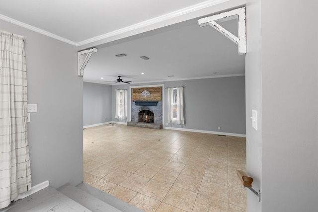 unfurnished living room featuring ceiling fan, light tile patterned floors, crown molding, and a brick fireplace