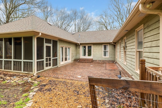 back of property featuring a patio area and a sunroom