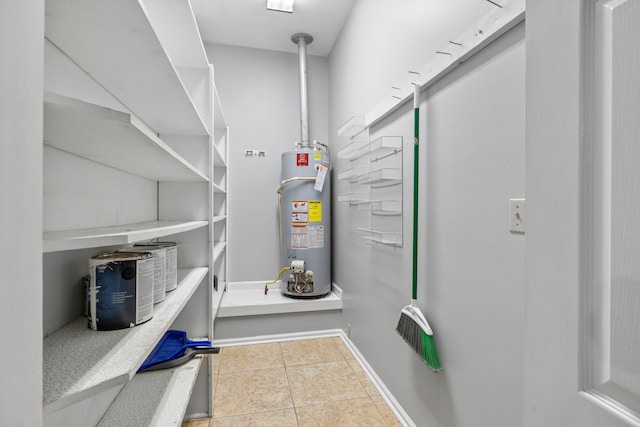 utility room with gas water heater