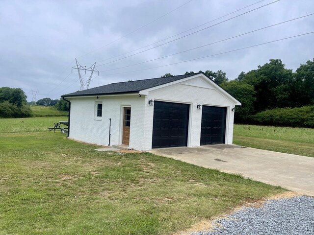 garage with a yard