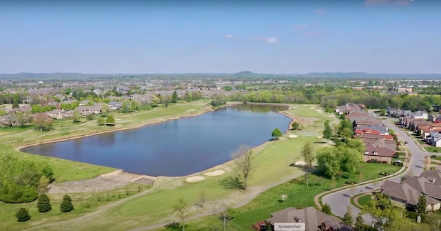 birds eye view of property featuring a water view and a residential view