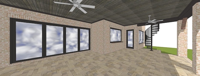 view of patio / terrace with ceiling fan and stairway