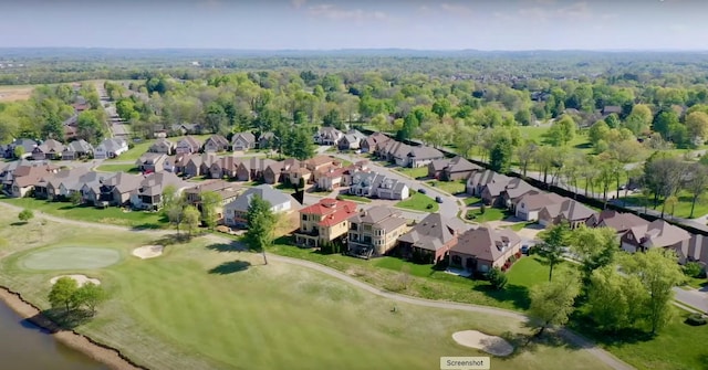 drone / aerial view featuring a residential view and golf course view