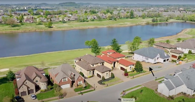 bird's eye view with a water view and a residential view