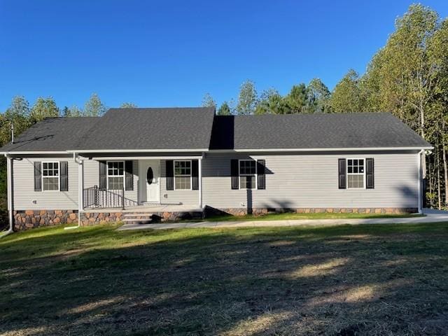 view of front of house featuring covered porch, a front yard, and crawl space