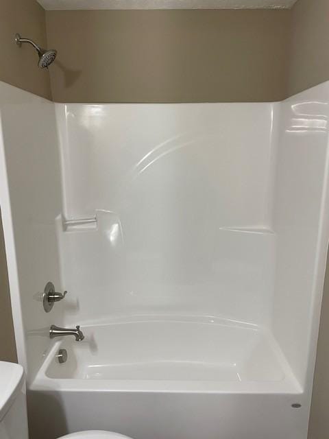 full bathroom featuring toilet and shower / bath combination