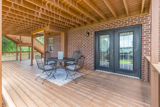 wooden deck featuring french doors