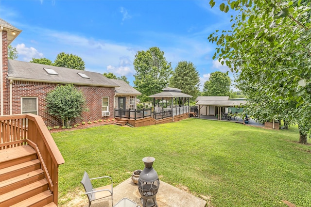 view of yard with a gazebo and a deck