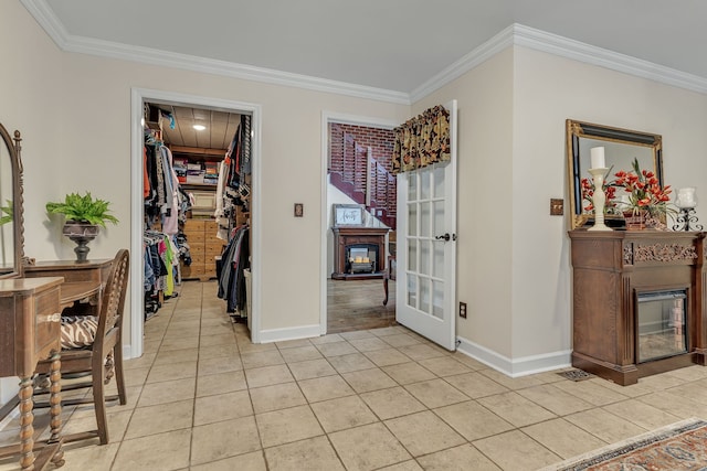 interior space featuring ornamental molding, light tile patterned floors, and french doors