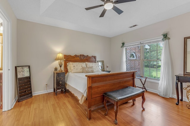 bedroom featuring light hardwood / wood-style floors and ceiling fan