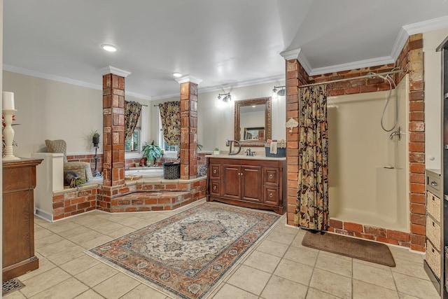 bathroom featuring tile patterned flooring, ornate columns, and vanity