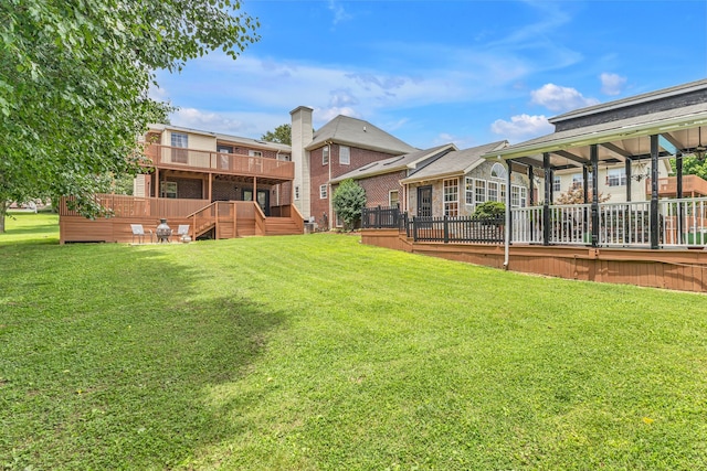 view of yard featuring a wooden deck