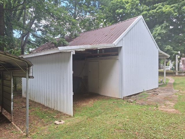 view of outbuilding with a lawn