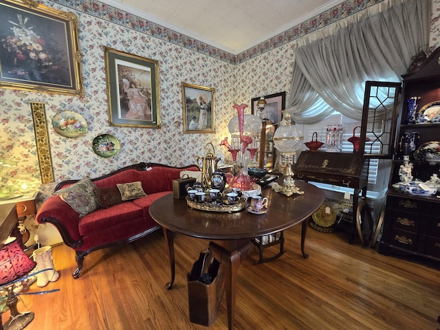 living room featuring ornamental molding and hardwood / wood-style floors