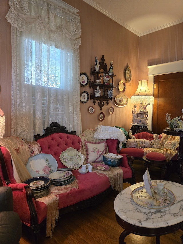 living room featuring crown molding and hardwood / wood-style flooring