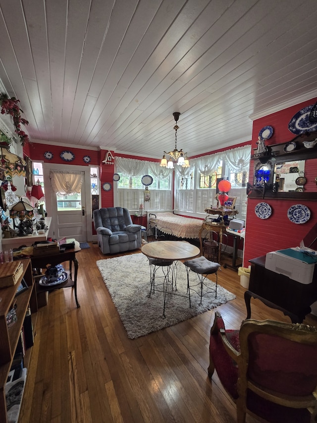 living room with wood ceiling, an inviting chandelier, and hardwood / wood-style flooring