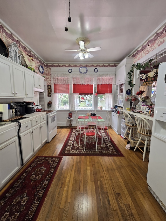 kitchen featuring light hardwood / wood-style floors, white cabinetry, ceiling fan, and white appliances