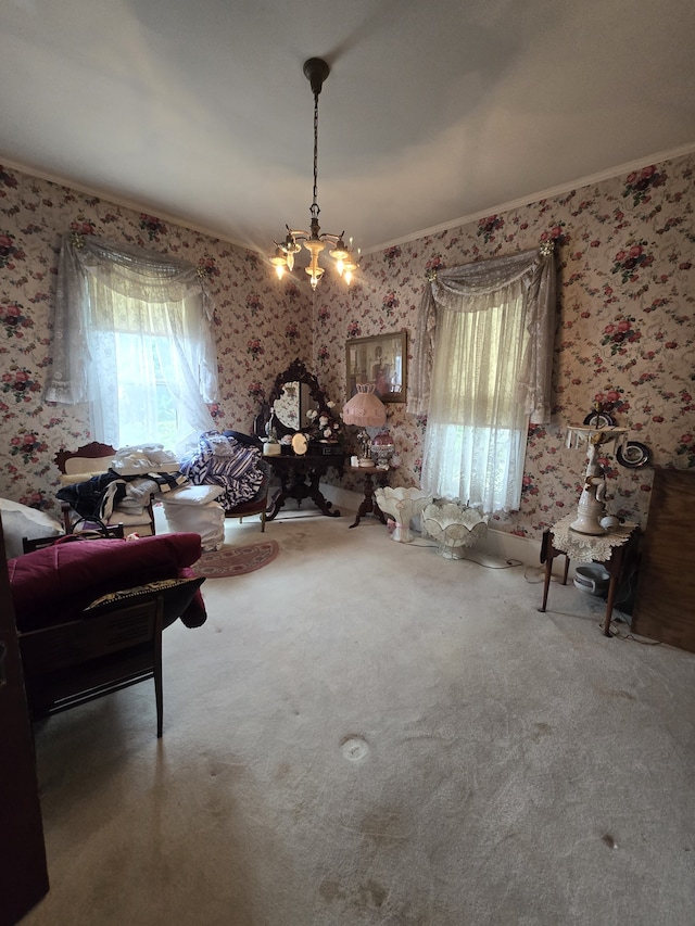 living area with crown molding, carpet, and a notable chandelier