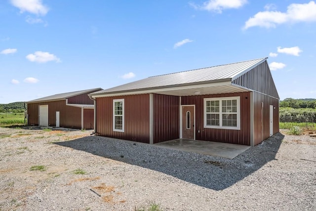 view of front facade with an outbuilding