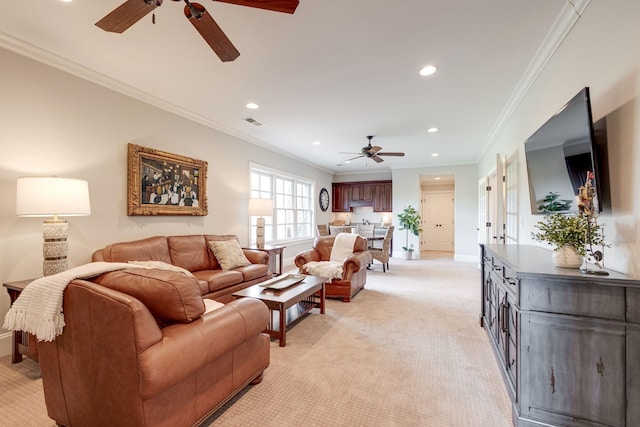 carpeted living room with ceiling fan and crown molding