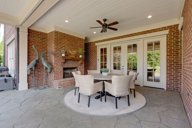 view of patio / terrace with ceiling fan, french doors, and an outdoor brick fireplace