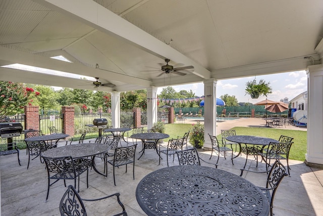 view of patio featuring ceiling fan and grilling area