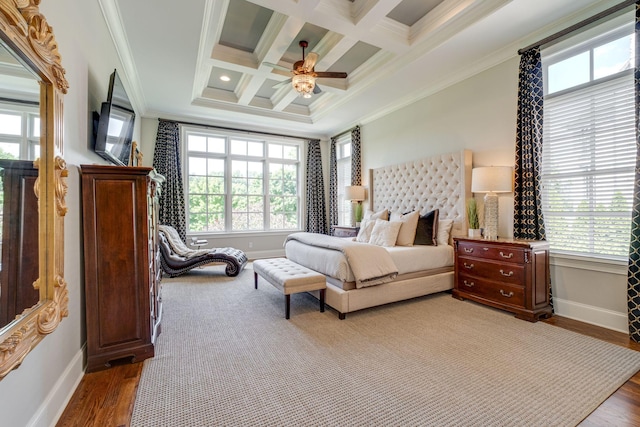 bedroom featuring beamed ceiling, ceiling fan, ornamental molding, and coffered ceiling