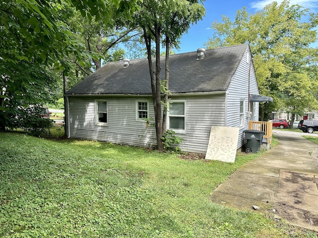 view of home's exterior with a lawn