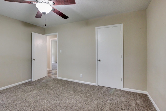 unfurnished room featuring carpet flooring and ceiling fan