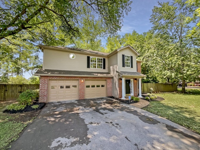 front of property with a garage and a front yard