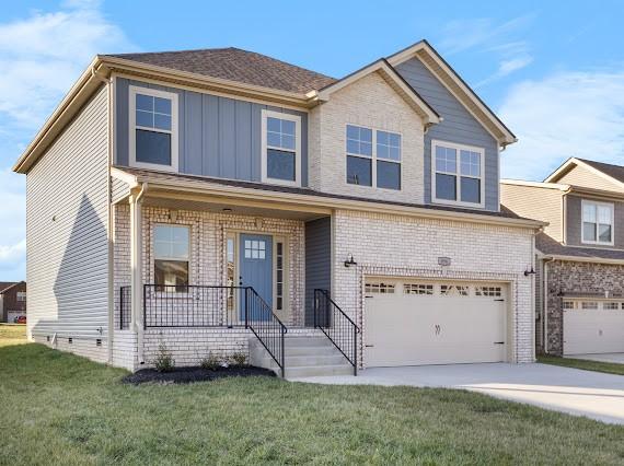 view of front facade with a front lawn and a garage