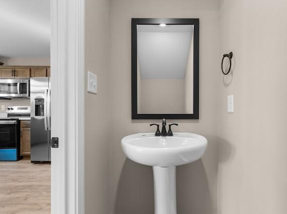 bathroom featuring hardwood / wood-style flooring