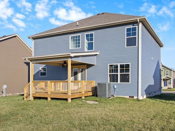 back of house featuring a lawn, cooling unit, a deck, and ceiling fan