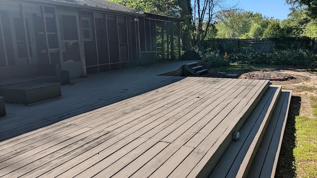 deck with a sunroom