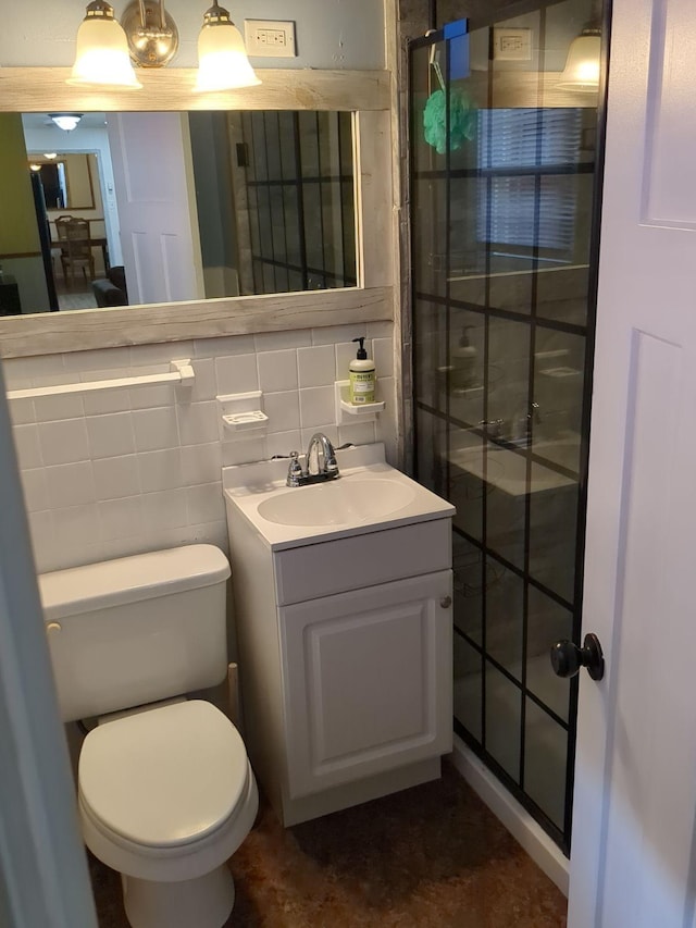 bathroom with vanity, toilet, decorative backsplash, and tile walls