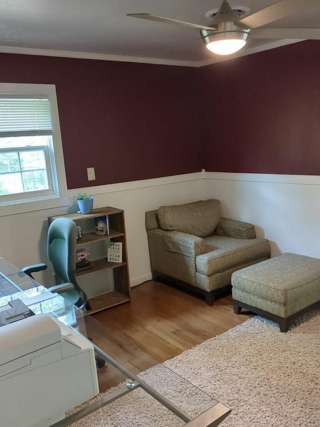 living room with hardwood / wood-style floors and ornamental molding