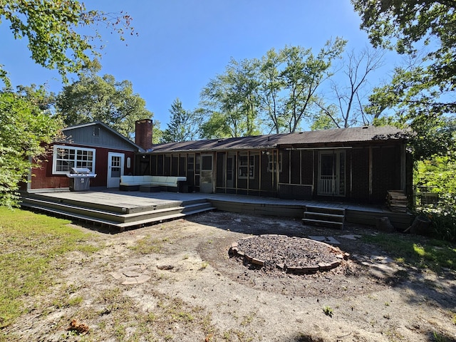 rear view of house featuring outdoor lounge area and a wooden deck