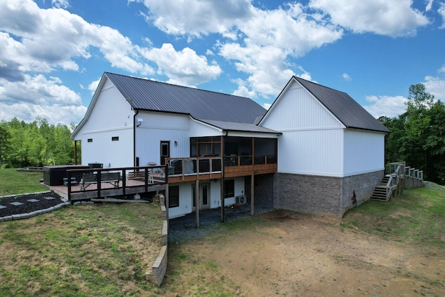 1033 Carter Rd SE, Old Fort, TN 37362 - rear view of property featuring a wooden deck, a sunroom, and a yard