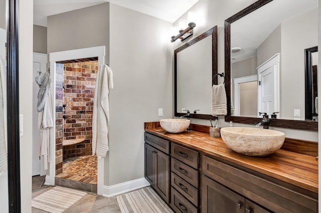 1033 Carter Rd SE, Old Fort, TN 37362 - bathroom with vanity, tile patterned flooring, and a tile shower