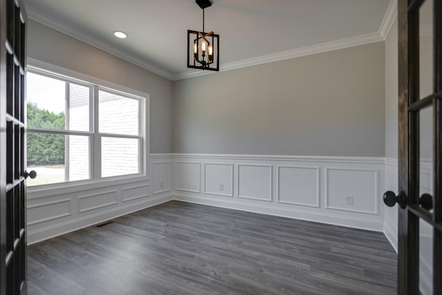 unfurnished room with ornamental molding, an inviting chandelier, and a healthy amount of sunlight