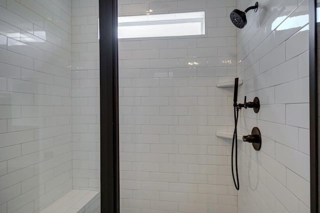 bathroom featuring tiled shower