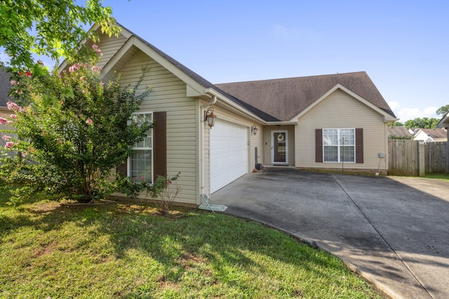 single story home with a front yard and a garage