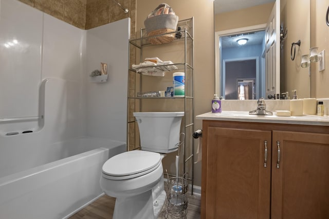 520 Oakmont Dr NW, Clarksville, TN 37042 - full bathroom with vanity, toilet, baseboards, bathing tub / shower combination, and wood finished floors