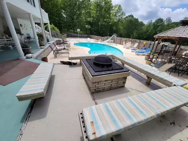 view of swimming pool with a gazebo and a patio area