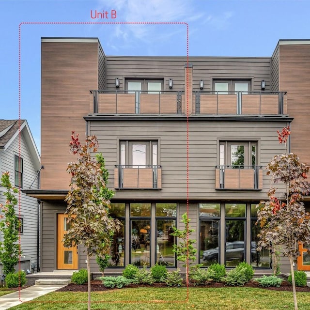 view of front of home with a balcony