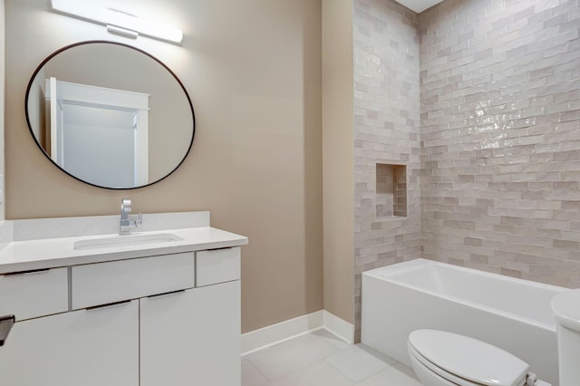 full bathroom featuring tile patterned floors, toilet, tiled shower / bath combo, and vanity