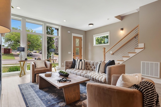 living room with light hardwood / wood-style flooring