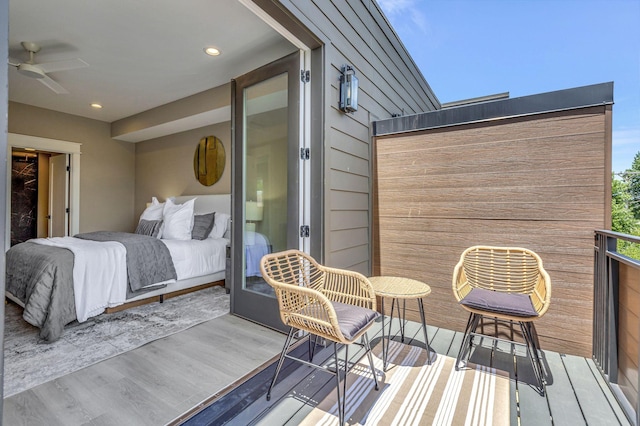 exterior space with ceiling fan and light hardwood / wood-style flooring