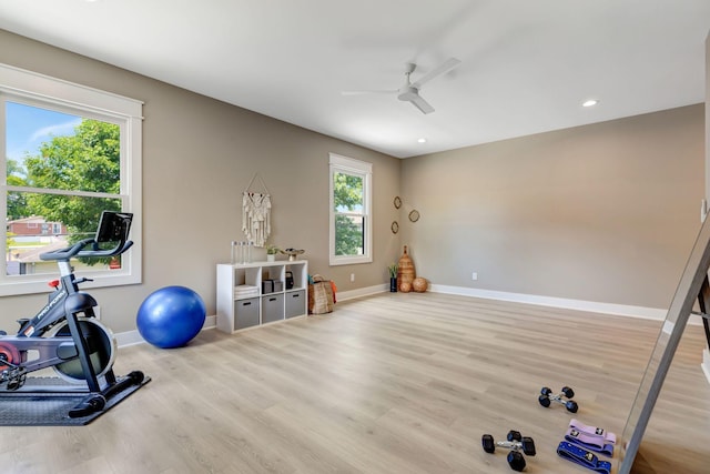 exercise area featuring ceiling fan, baseboards, wood finished floors, and recessed lighting