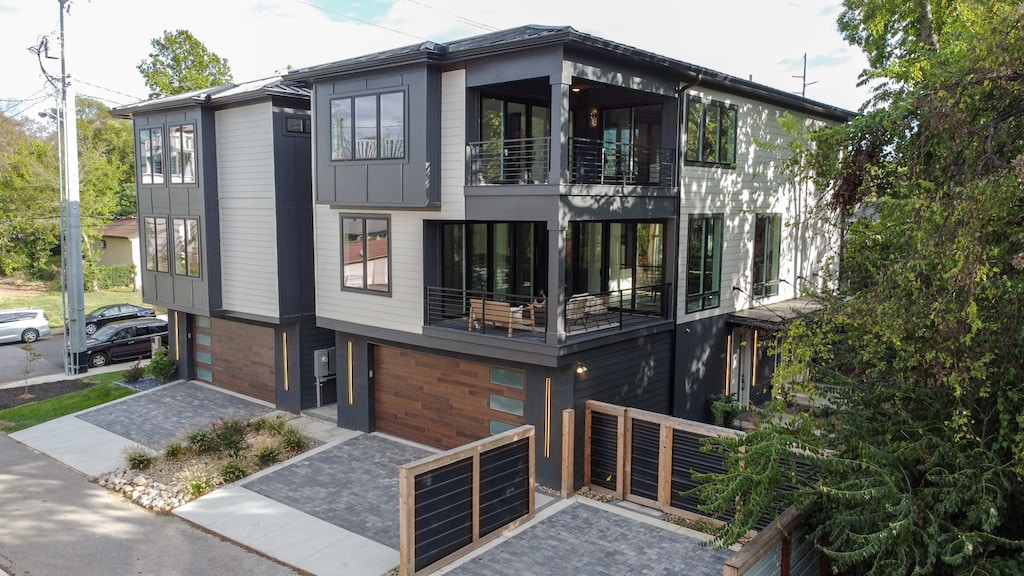 view of side of home featuring a balcony